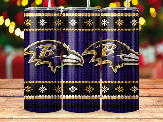 Three purple tumblers with Baltimore Ravens logos and snowflake designs on a wooden surface.