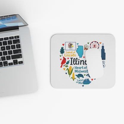 Mousepad with Illinois map heart design and local icons, next to a laptop.