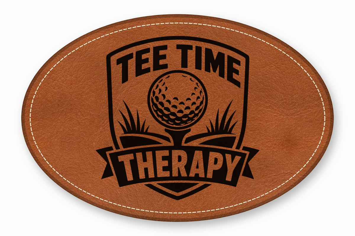 An oval brown leather patch with white stitching featuring a black golf emblem and text reading "TEE TIME THERAPY".