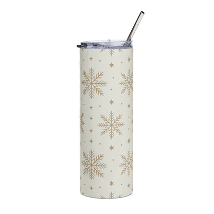 Cream tumbler with gold snowflake and star pattern and silver straw.