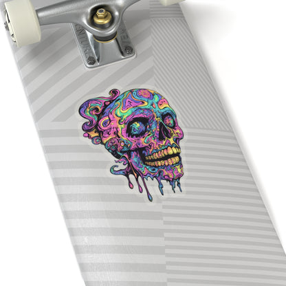 Colorful melting skull sticker on a skateboard deck with silver trucks.