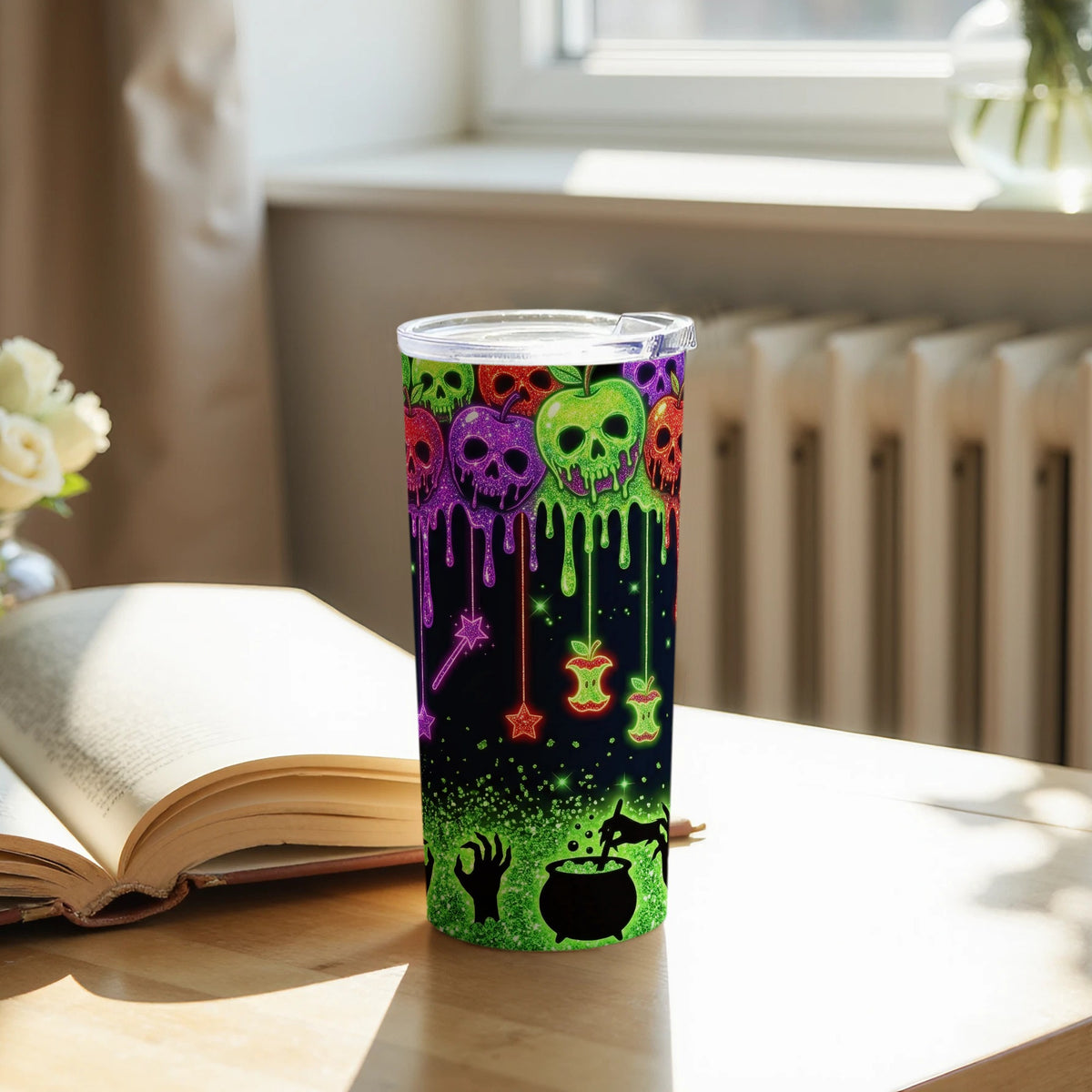 Tumbler with dripping skull apples, witch's cauldron, zombie hand, and stars.