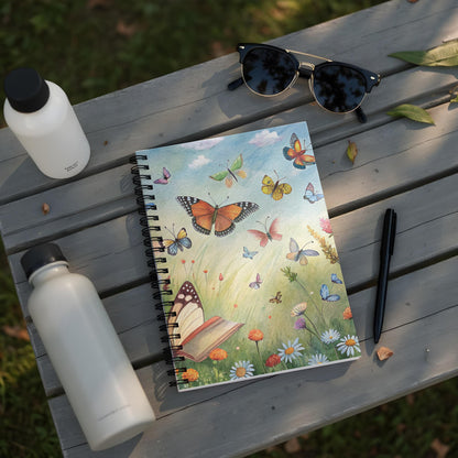 Spiral notebook with butterflies and flowers design on open pages.