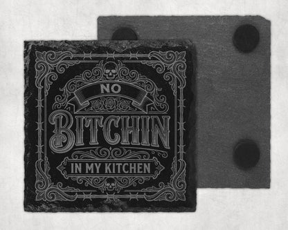 Slate coaster with "No Bitchin In My Kitchen" text and skull design