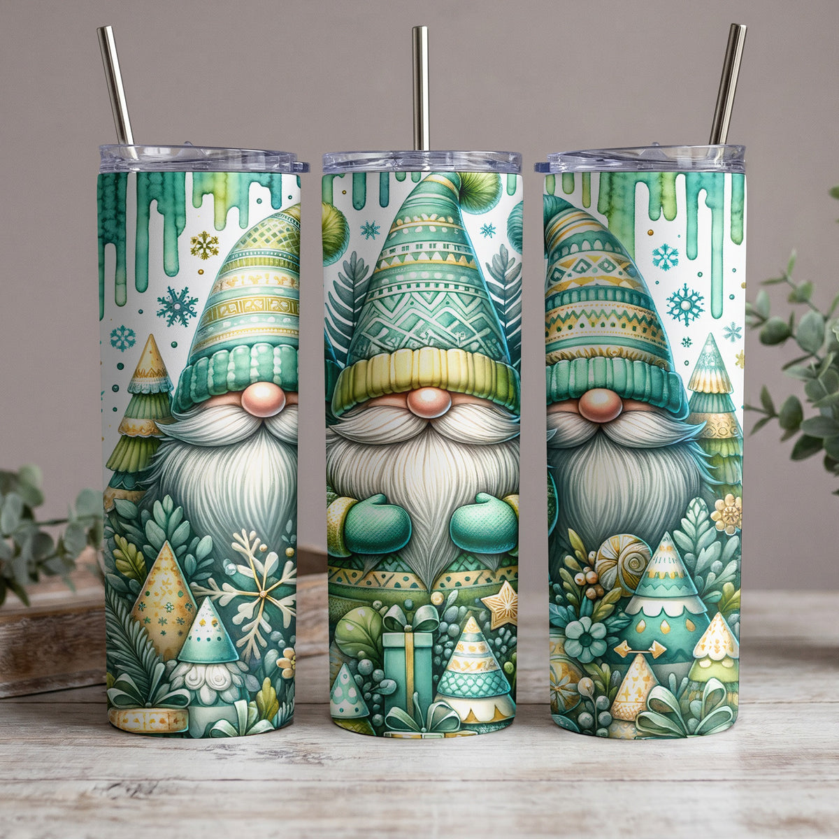 Three tumblers with a Christmas gnome and forest design in green and yellow.
