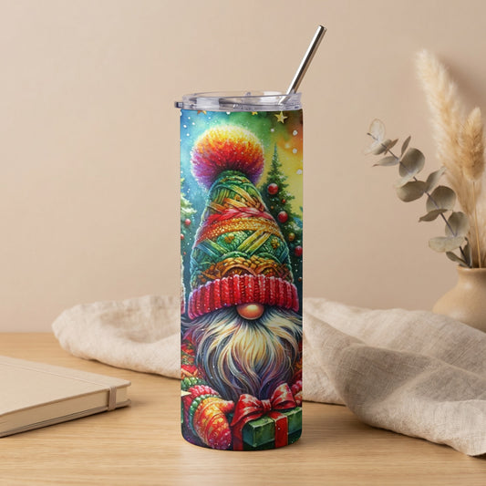 Tumbler with a colorful gnome wearing a hat and scarf, holding a gift.