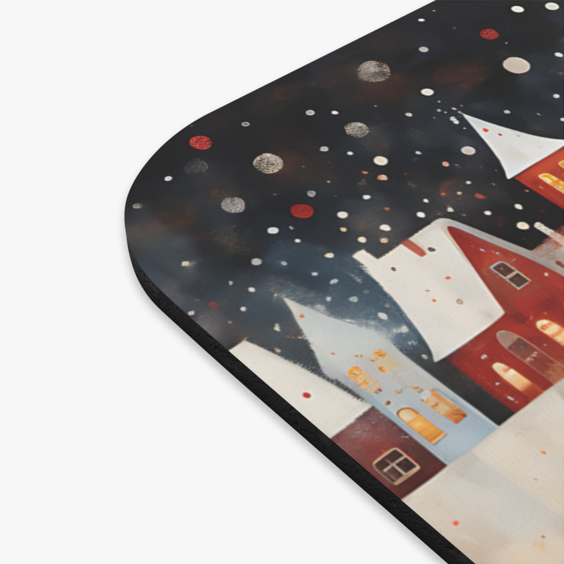 Whimsical watercolor illustration of snowy houses under a starry sky.