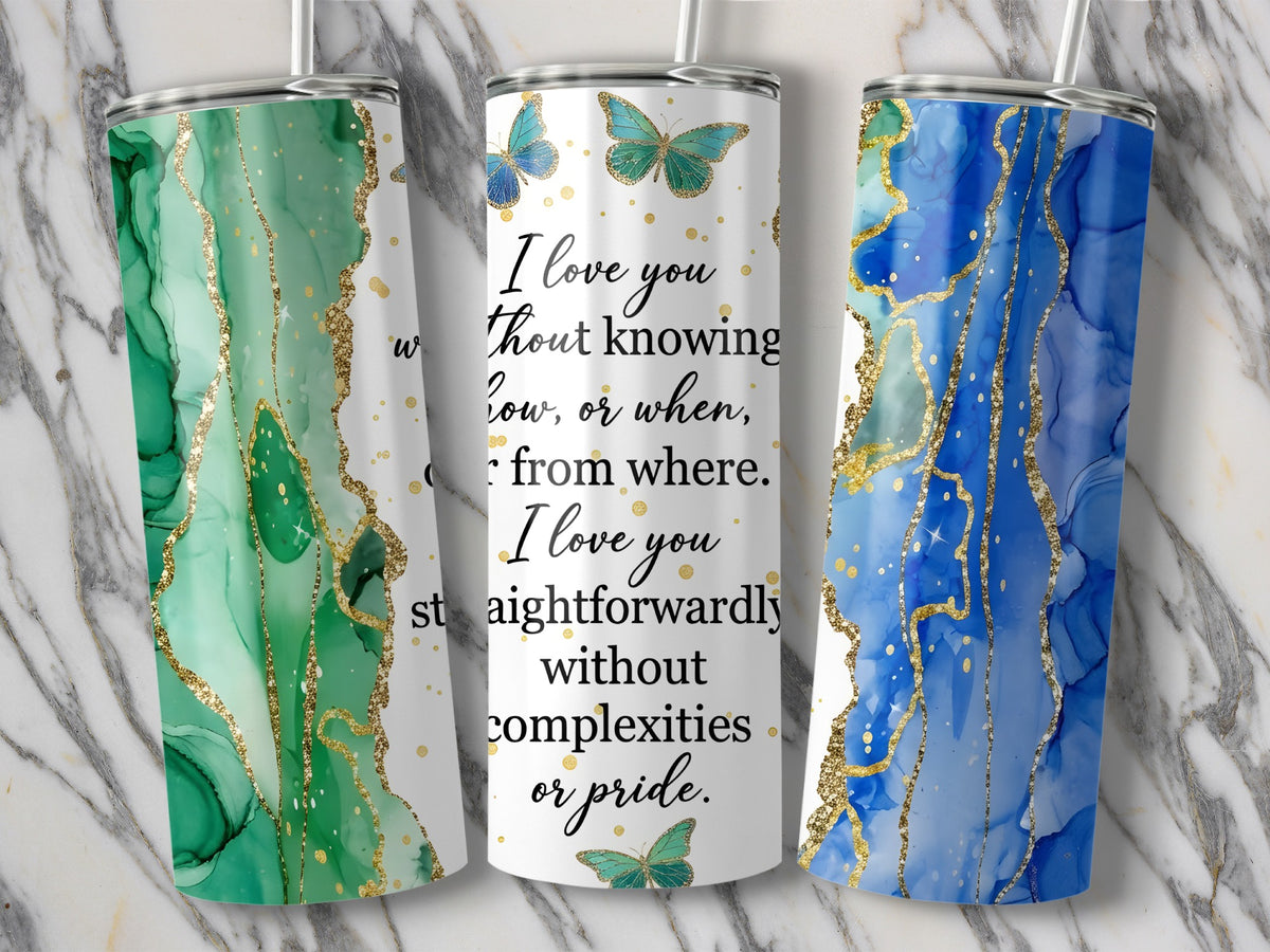 Three tumblers with abstract green, white, and blue marbled designs and gold glitter accents.