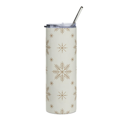 Tall tumbler with snowflake pattern and metal straw.