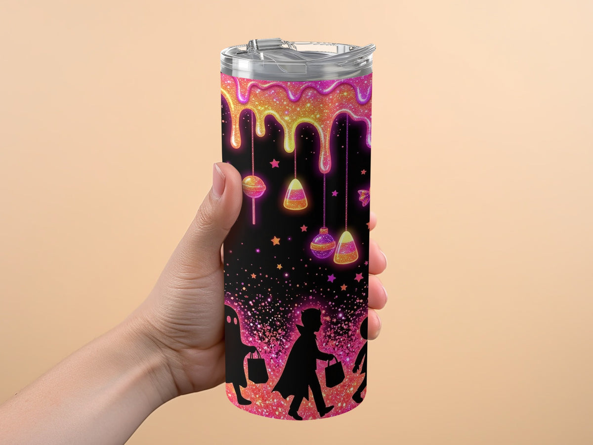 Tumbler with dripping glitter, candy, and Halloween trick-or-treaters silhouettes.