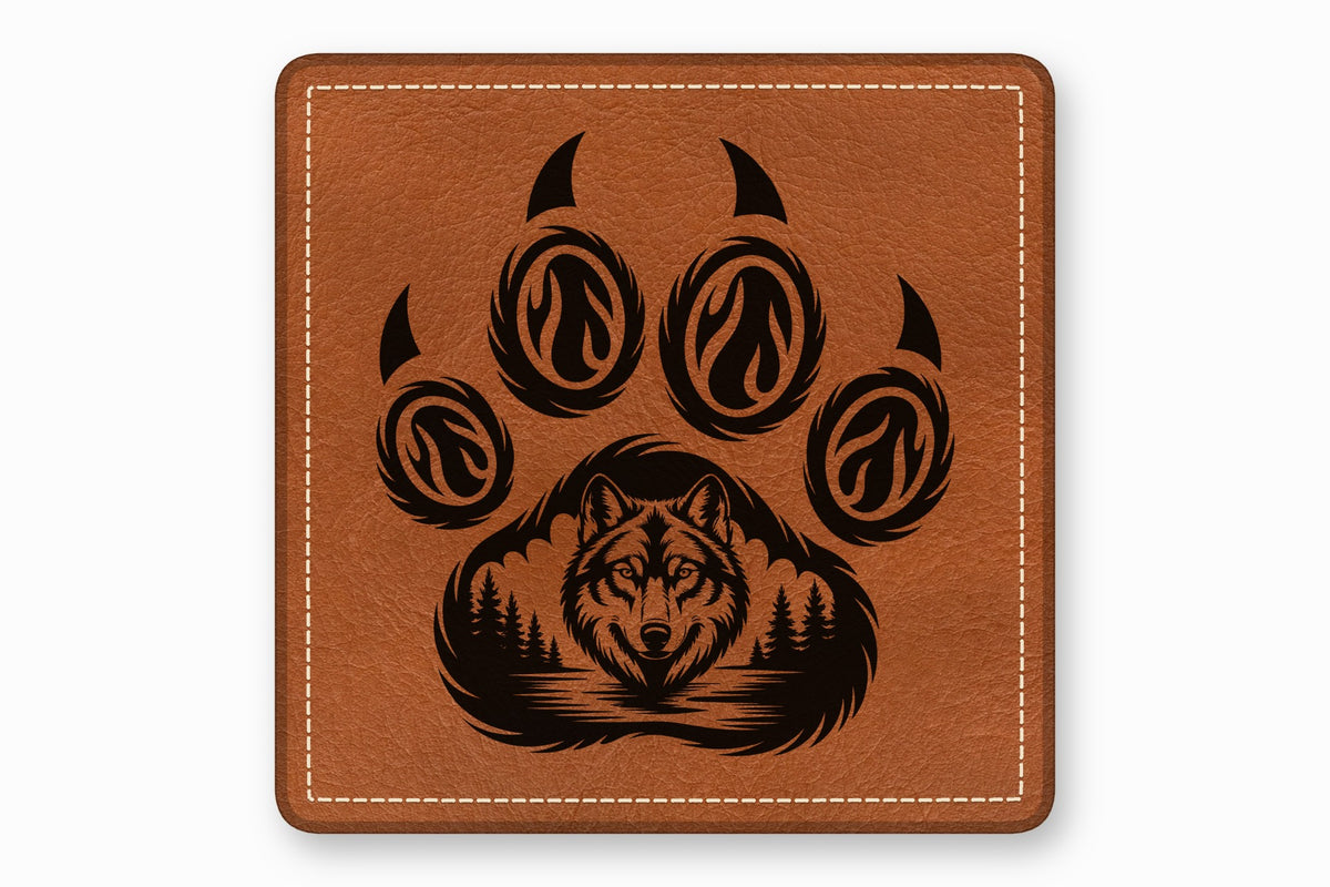 Square brown leather patch with white stitched border and a black laser-engraved wolf face and paw print design.