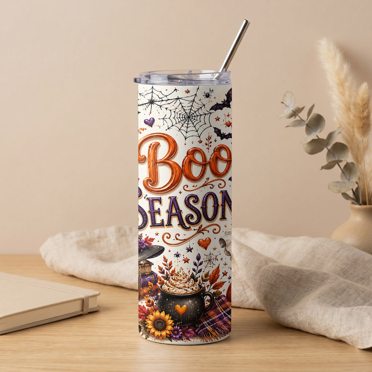Tumbler with "Boo Season" text and Halloween motifs including bats, spiders, and a pumpkin spice drink.
