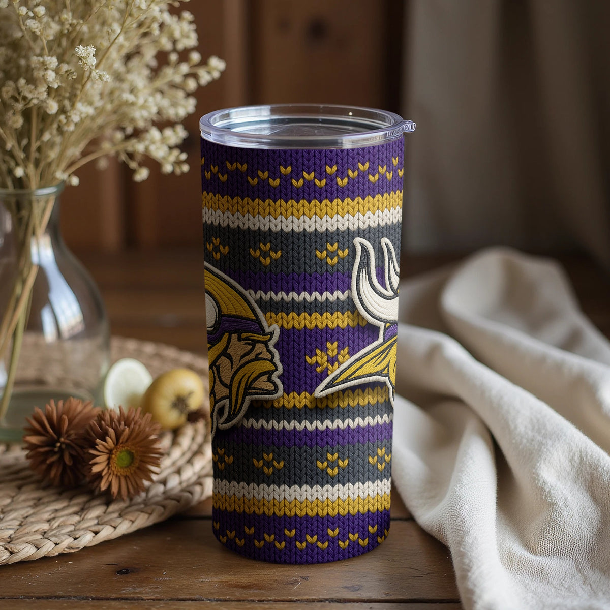 Minnesota Vikings tumbler with a knitted pattern and team logos.