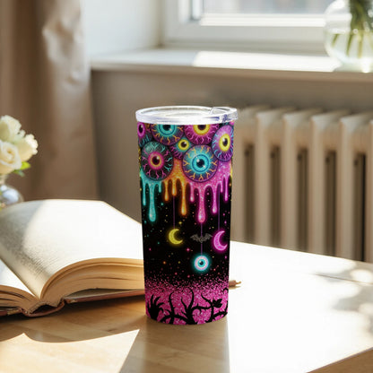 Tumbler with dripping eyeball and moon pattern with glittery thorny branches at the base.