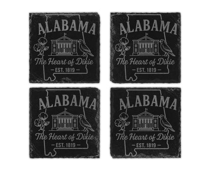 Four Alabama slate coasters with outline, state name, building, bird, cotton, and text.
