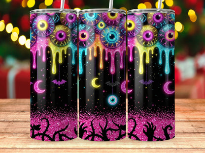 Tumbler with dripping eyeballs, moons, bats, and thorny vines on a black glitter background.