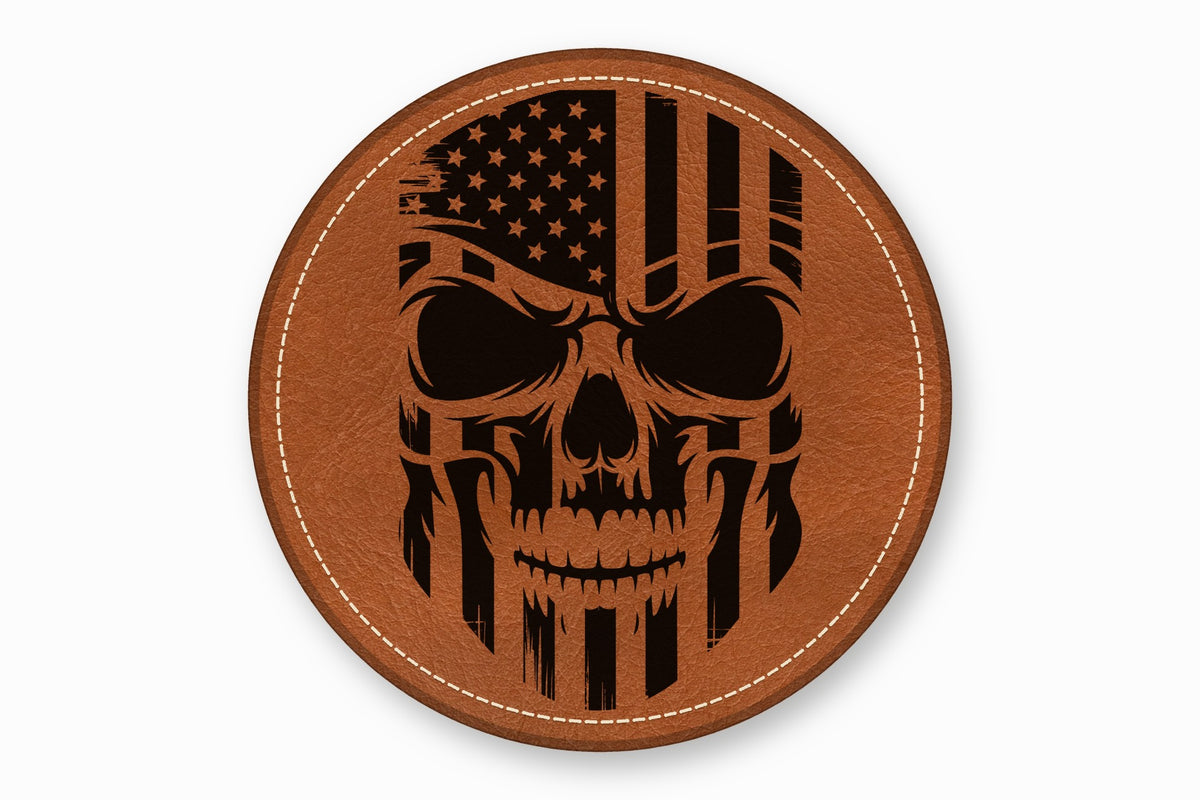 A brown leather round patch with a black distressed American flag skull design.
