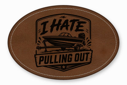 Oval brown leather patch with white stitching featuring a motorboat graphic and text reading I HATE PULLING OUT.