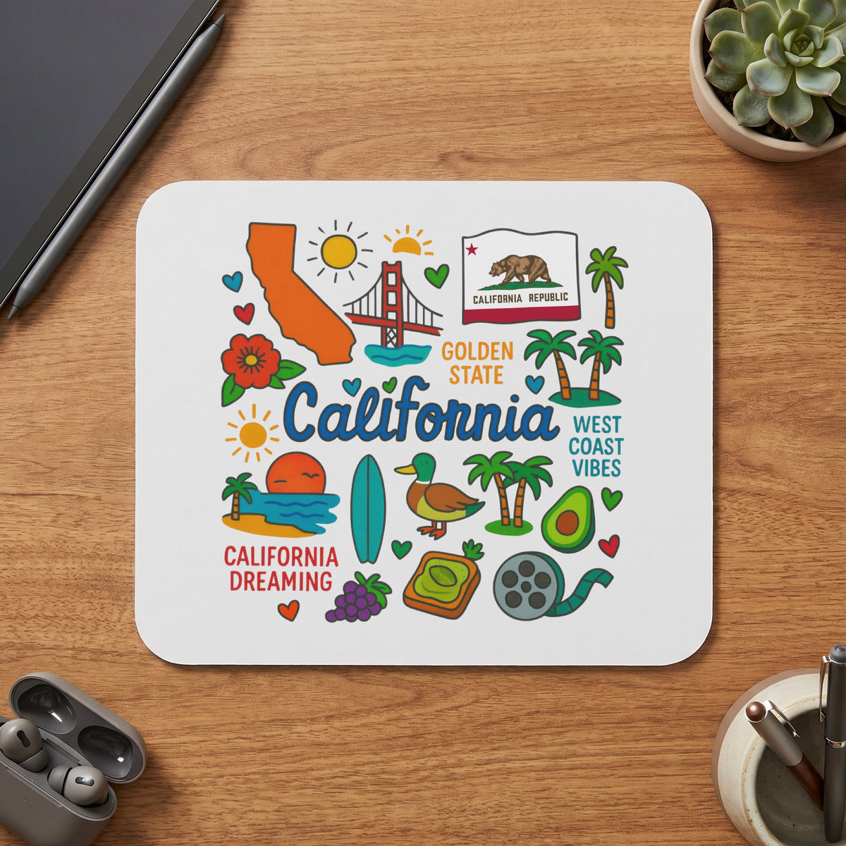 White mousepad with California-themed illustrations including the state outline, Golden Gate Bridge, and palm trees.