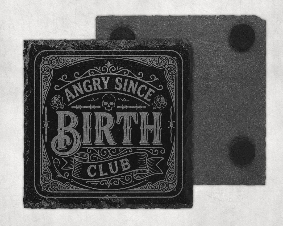 Slate coaster with text "Angry Since Birth Club" and decorative elements.