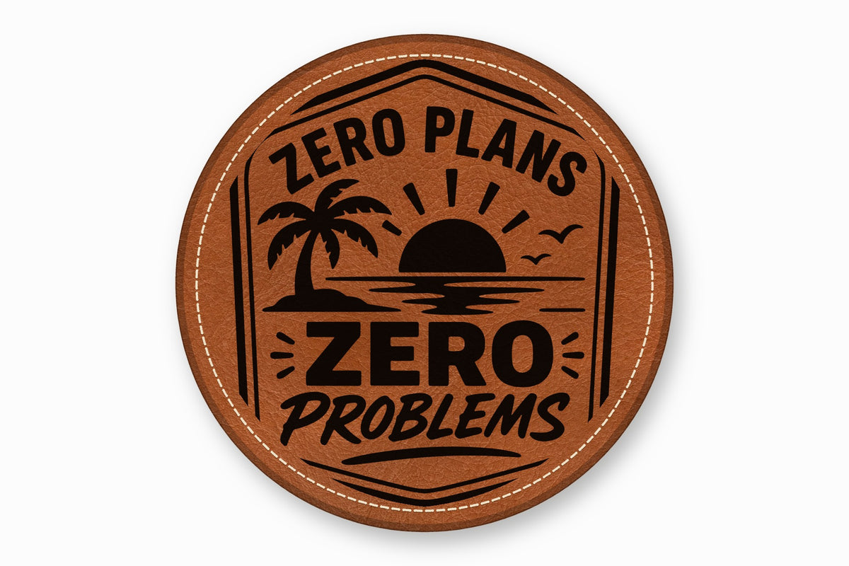 Round brown leather patch with white stitched border, featuring a black tropical sunset graphic and text.