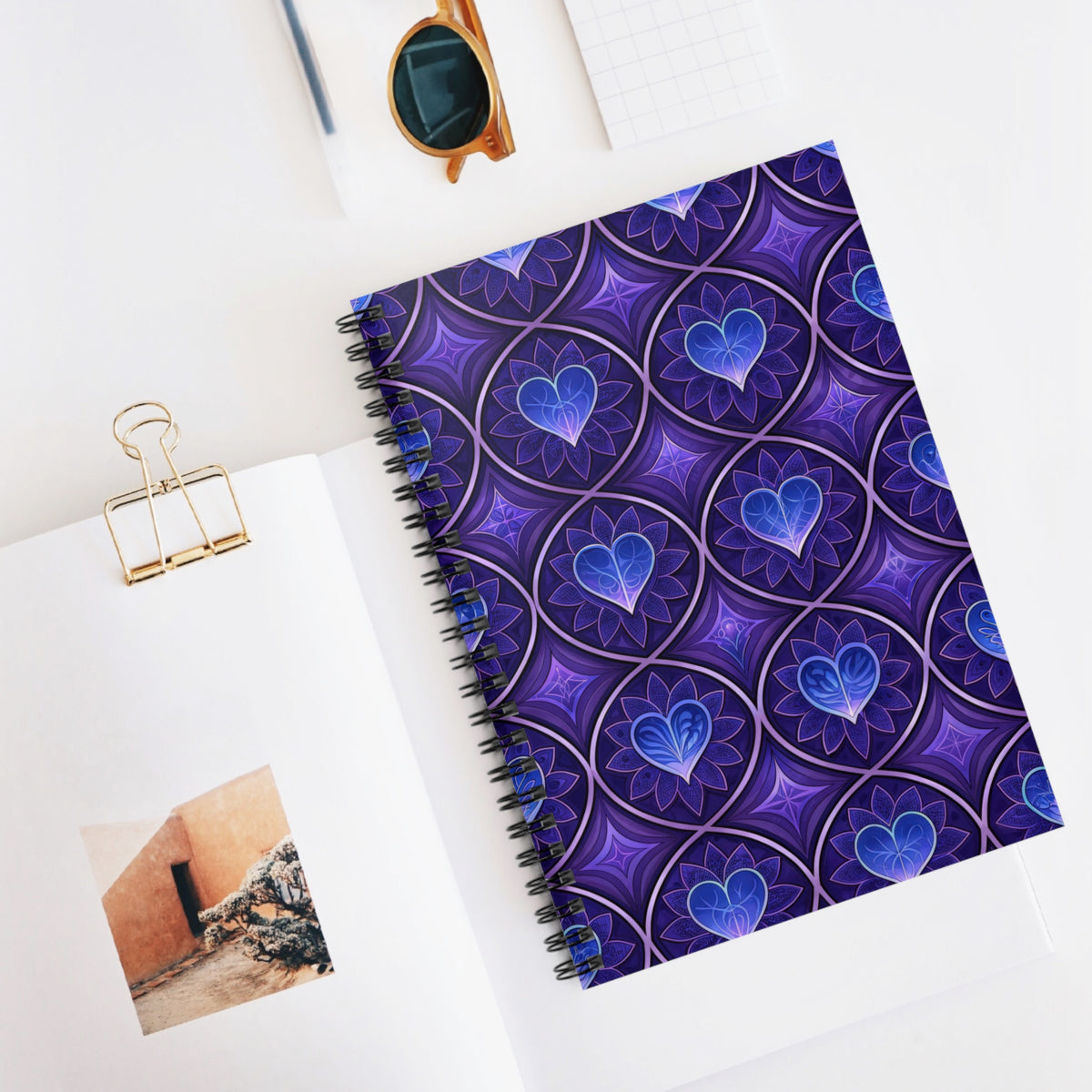 Spiral notebook with purple and blue fractal heart pattern on cover.