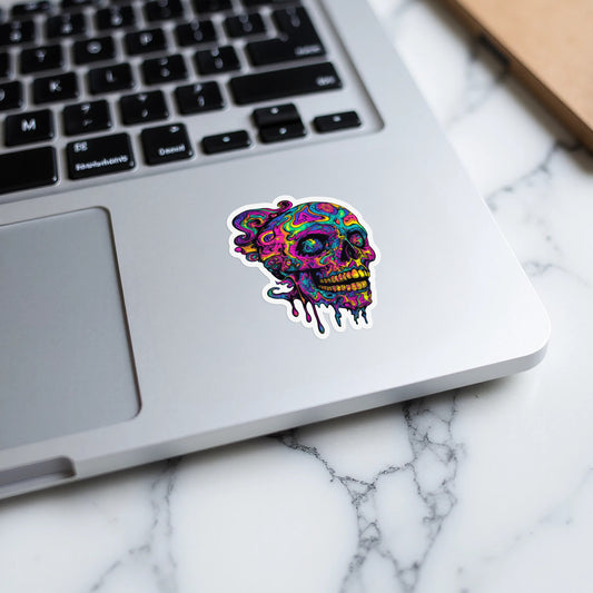 Dripping skull sticker with psychedelic colors on a laptop.