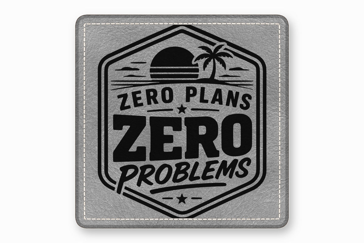 Square grey leather patch featuring a black engraved beach design with the text Zero Plans Zero Problems.