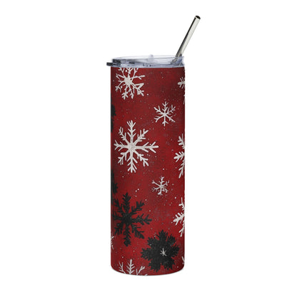 Red tumbler with snowflake pattern and a stainless steel straw.