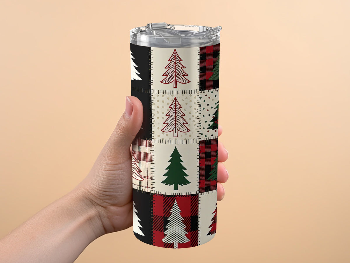 Tumbler with patchwork Christmas tree and plaid pattern design.