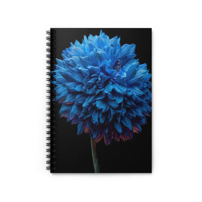 Spiral bound notebook with a vibrant blue flower and black cover.