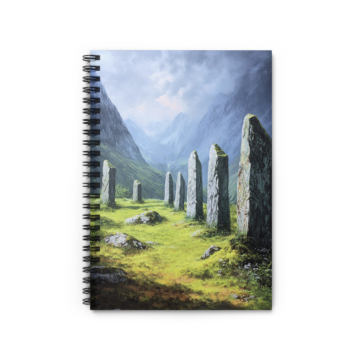 Stone circle in a green valley with mountains under a cloudy sky.