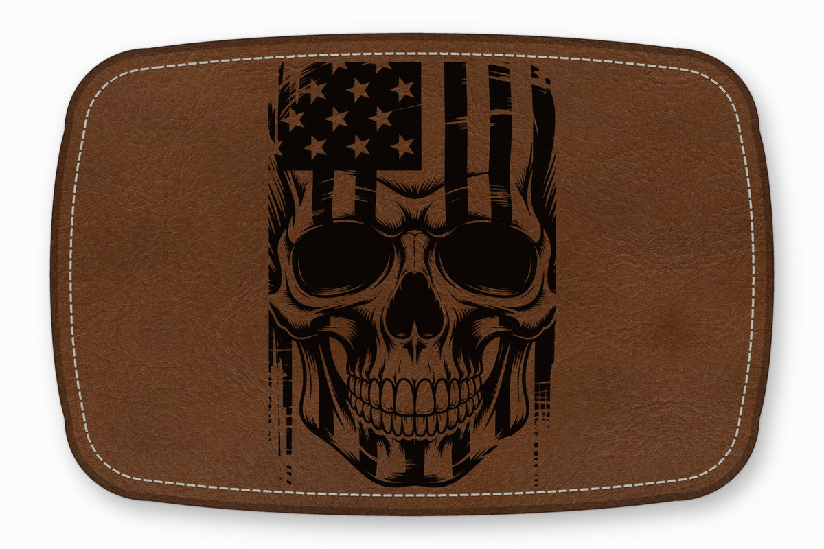 Brown leather patch with rounded corners featuring a black printed graphic of a skull overlaid with an American flag.