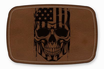Brown leather patch with rounded corners featuring a black printed graphic of a skull overlaid with an American flag.