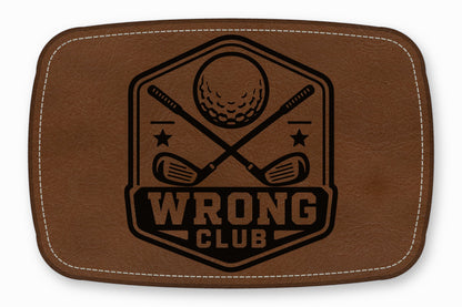 Brown rectangular leather patch featuring a black golf emblem with crossed clubs and text reading WRONG CLUB.