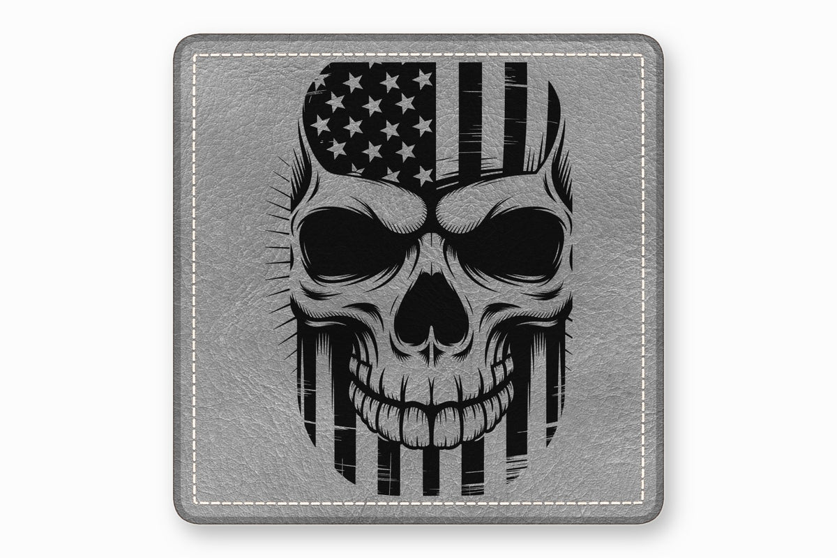 A square grey leather patch features a black and white graphic of a skull overlaid with an American flag.