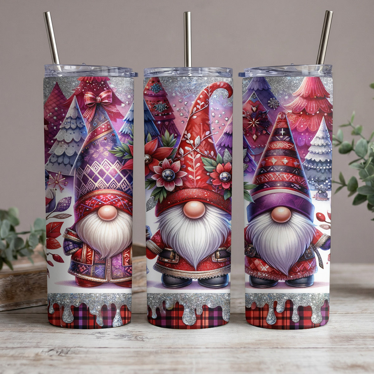 Three skinny tumblers featuring gnomes and festive trees with glitter accents.
