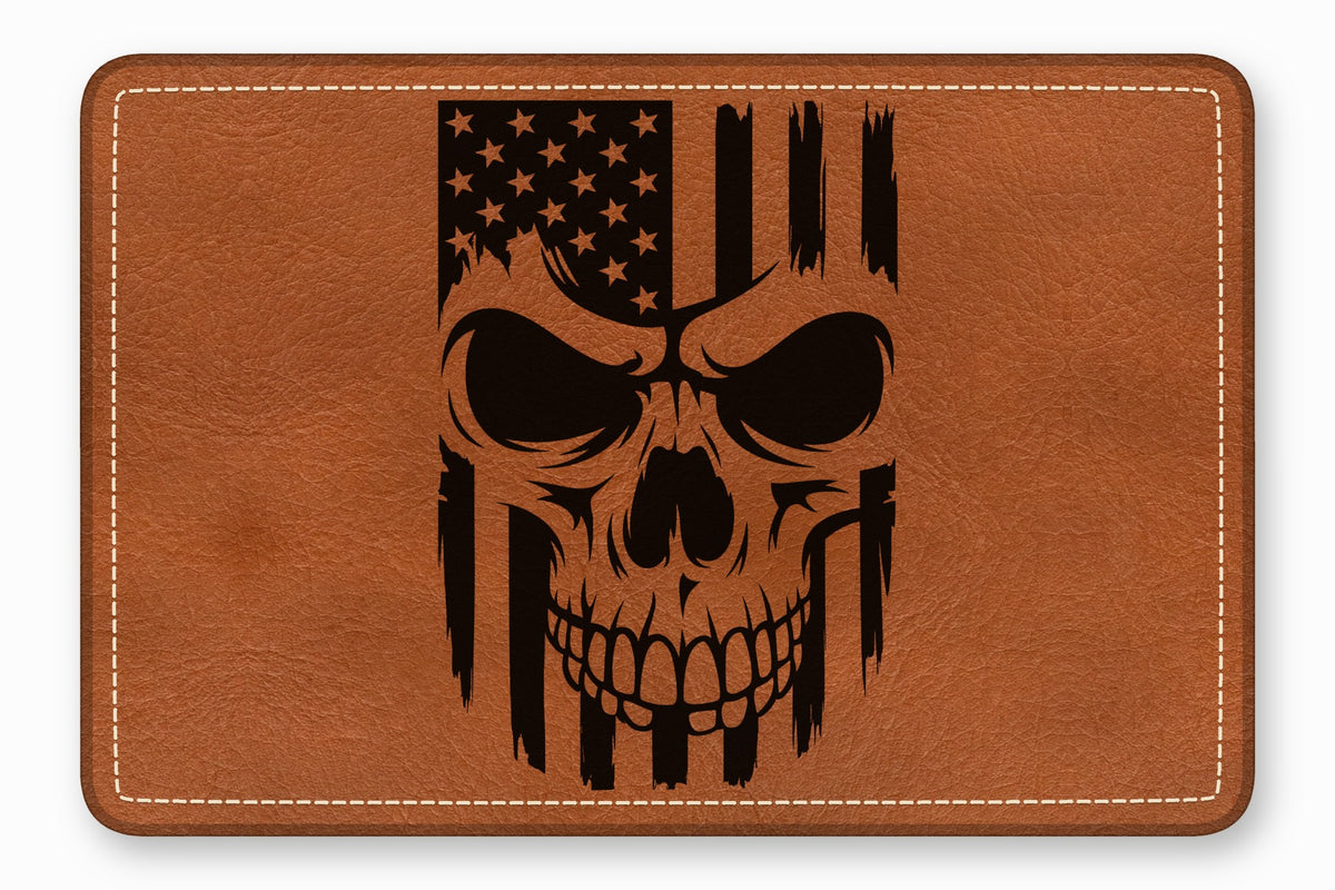 Brown leather patch with rounded corners featuring a black engraved skull and American flag design.