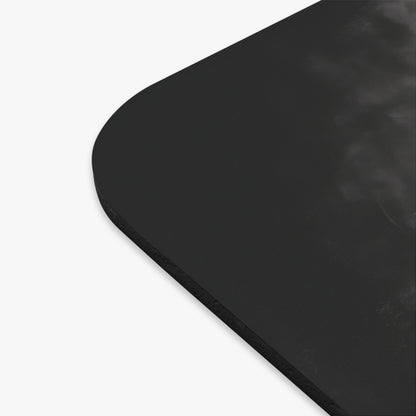 Black mousepad with rounded corners on a white background.