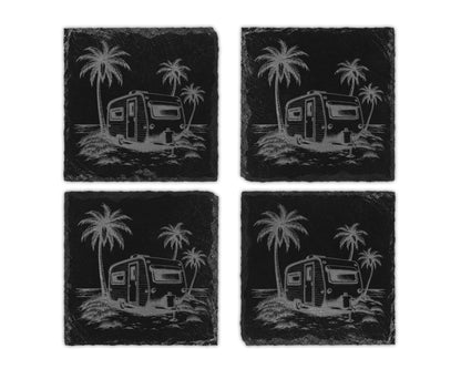Four square black slate coasters featuring an engraved design of a vintage camper and palm trees.