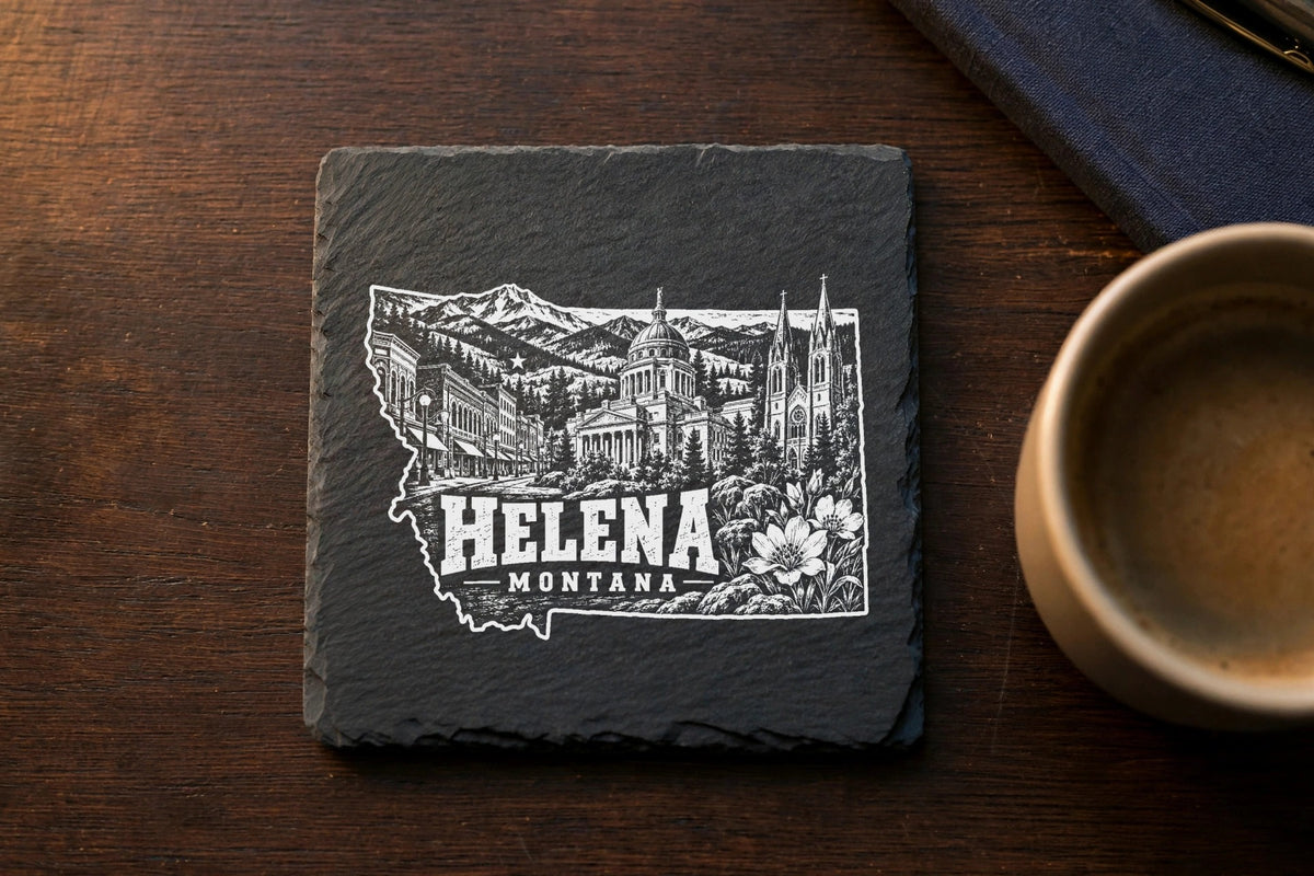 Square black slate coaster engraved with a Helena, Montana state outline map and city landmarks.