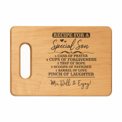 Wooden cutting board with "Recipe for a Special Son" and ingredient list.