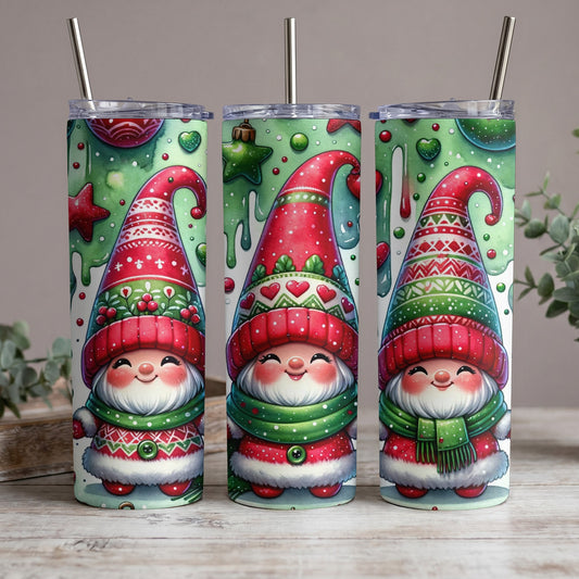 Three tumblers with a Christmas gnome design, featuring red hats, green scarves, and festive patterns.