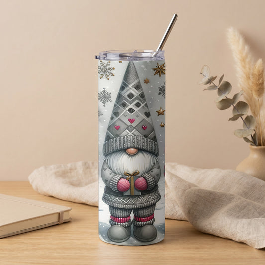Gray tumbler with a gnome holding a gift, snowflakes, and gold stars.