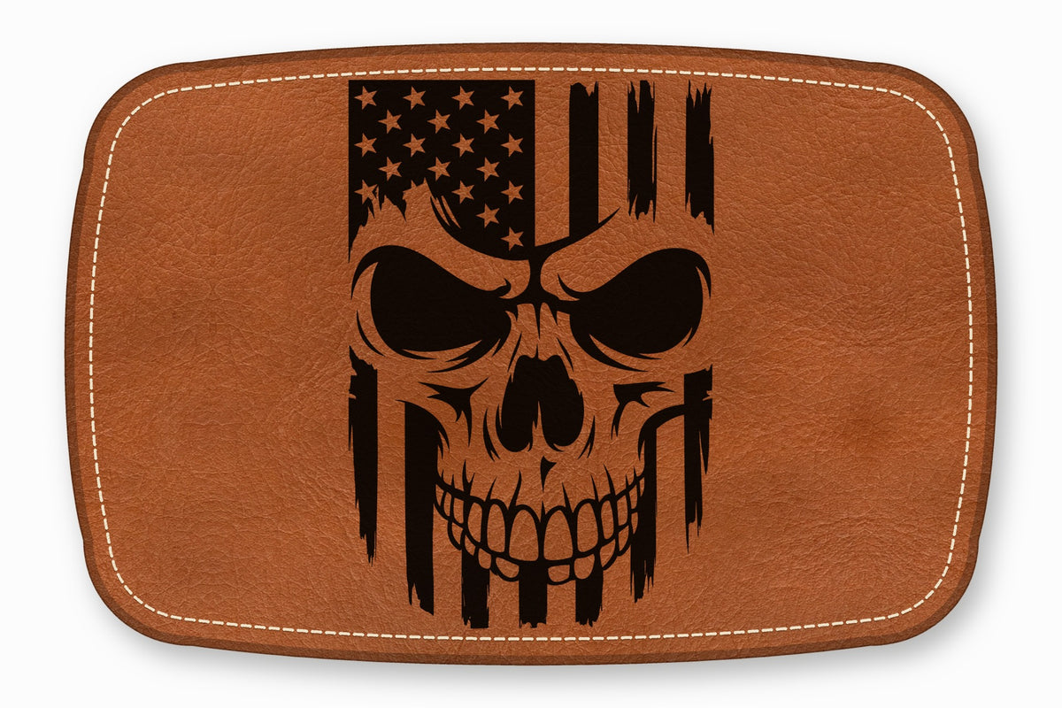 Brown leather patch with white stitched border and a black distressed American flag skull design.