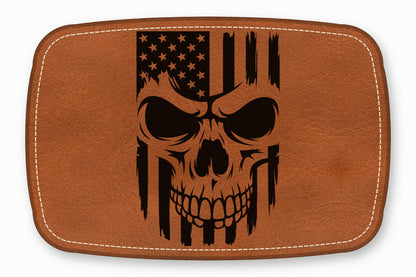 Brown leather patch with white stitched border and a black distressed American flag skull design.