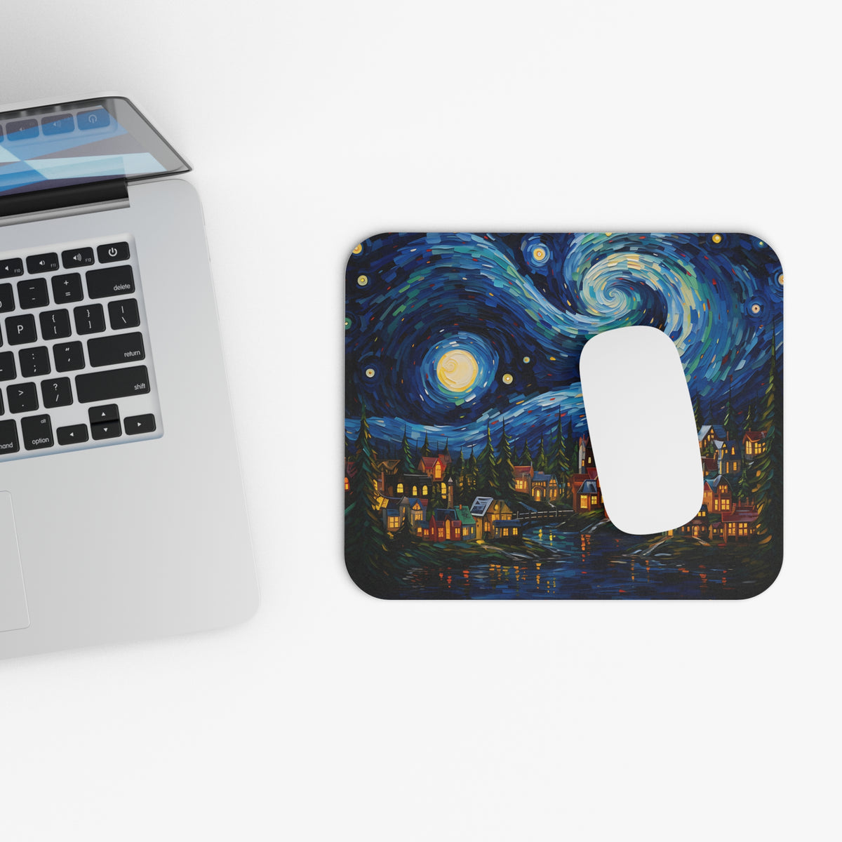 Mousepad with Van Gogh's Starry Night painting and a white computer mouse.