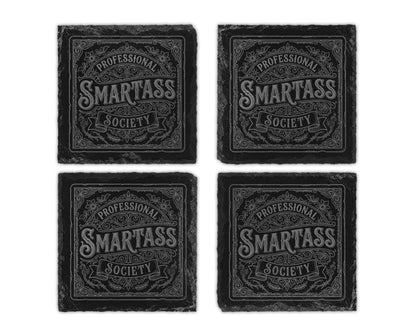 Four square black slate coasters with "PROFESSIONAL SMARTASS SOCIETY" etched design.
