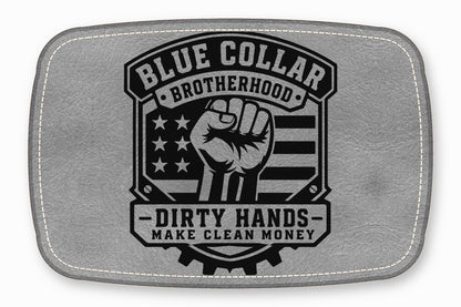 Gray leather patch with white stitched border, featuring a raised black design of a raised fist, American flag, and text reading Blue Collar Brotherhood and Dirty Hands Make Clean Money.