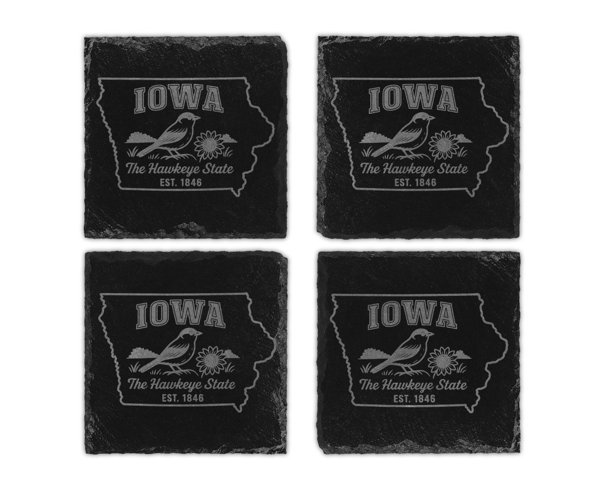 Set of four Iowa slate coasters with bird and flower design.